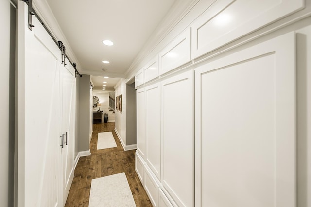 1078 Sunset Dr, Gallatin, TN 37066 - hallway with a barn door, recessed lighting, ornamental molding, dark wood-style flooring, and baseboards