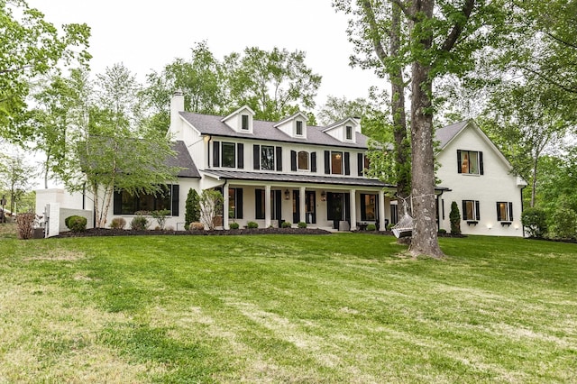 1078 Sunset Dr, Gallatin, TN 37066 - view of front facade featuring a front lawn, a porch, and a chimney