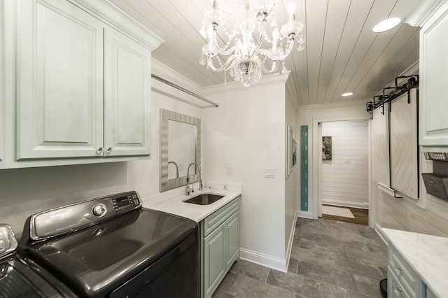 1078 Sunset Dr, Gallatin, TN 37066 - laundry room with cabinet space, a chandelier, independent washer and dryer, crown molding, and a barn door