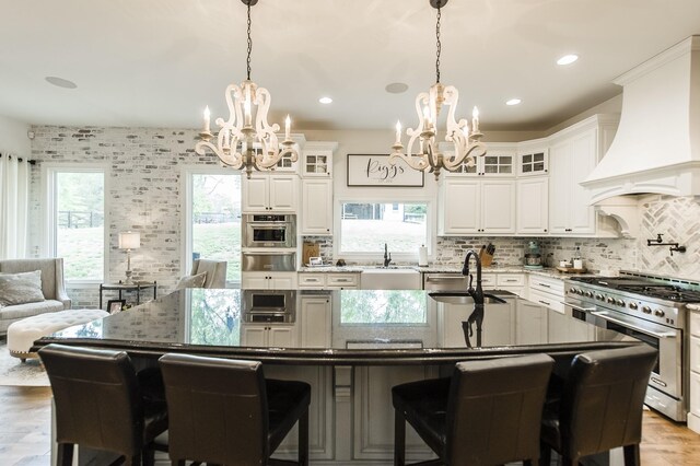 1078 Sunset Dr, Gallatin, TN 37066 - kitchen with appliances with stainless steel finishes, a chandelier, a sink, a warming drawer, and recessed lighting