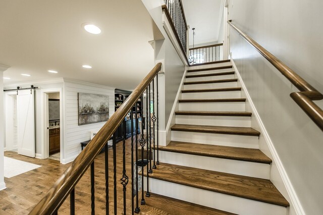 1078 Sunset Dr, Gallatin, TN 37066 - stairway with a barn door, wood finished floors, recessed lighting, and crown molding