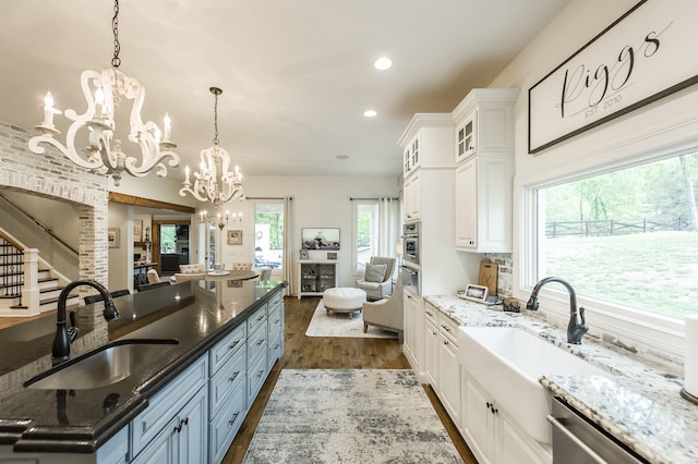 1078 Sunset Dr, Gallatin, TN 37066 - kitchen featuring a sink, a chandelier, dark wood-type flooring, appliances with stainless steel finishes, and recessed lighting