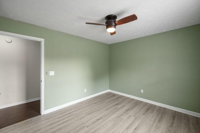 1006 Aretha Dr, Murfreesboro, TN 37128 - empty room featuring wood finished floors, a ceiling fan, baseboards, a textured ceiling, and a smoke detector