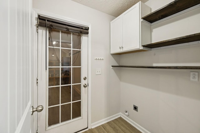 1006 Aretha Dr, Murfreesboro, TN 37128 - washroom with electric dryer hookup, cabinet space, wood finished floors, baseboards, and a textured ceiling