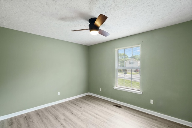 1006 Aretha Dr, Murfreesboro, TN 37128 - unfurnished room featuring wood finished floors, ceiling fan, a textured ceiling, and baseboards