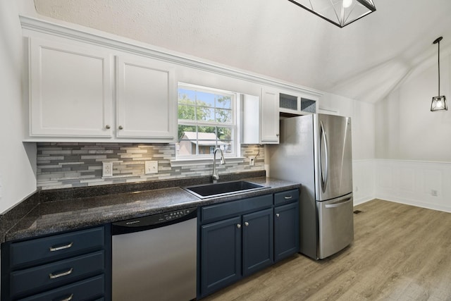 1006 Aretha Dr, Murfreesboro, TN 37128 - kitchen featuring appliances with stainless steel finishes, a sink, blue cabinetry, white cabinetry, and lofted ceiling