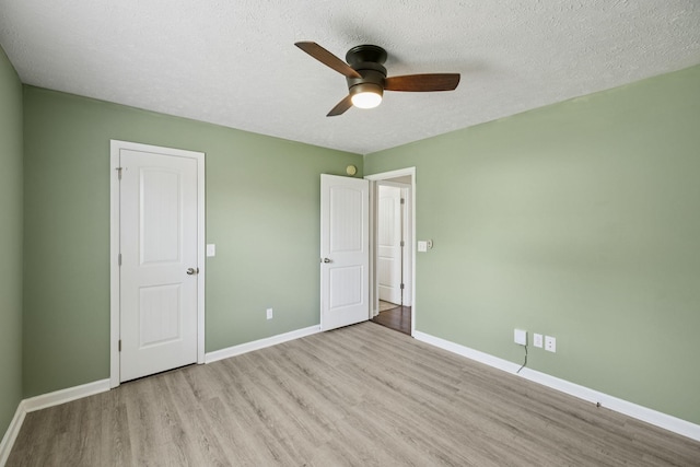 1006 Aretha Dr, Murfreesboro, TN 37128 - unfurnished bedroom featuring wood finished floors, baseboards, a textured ceiling, and ceiling fan