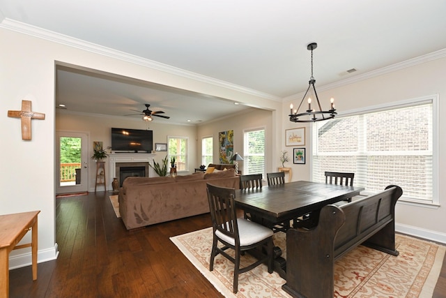 146 Monarchos Dr, Gallatin, TN 37066 - dining area with dark wood-style floors, baseboards, a chandelier, ornamental molding, and a fireplace