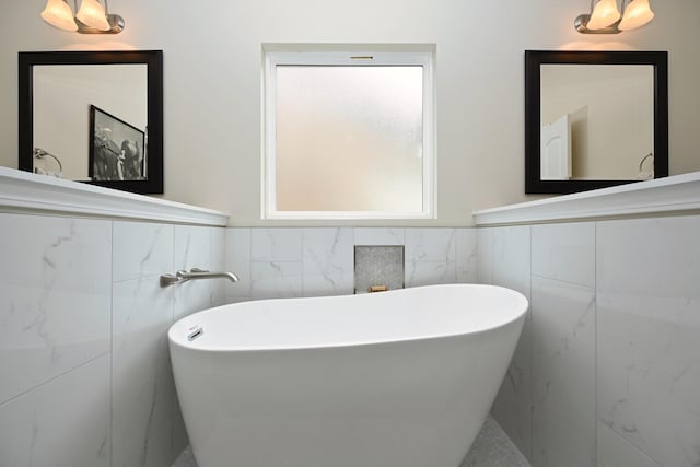 146 Monarchos Dr, Gallatin, TN 37066 - bathroom with tile walls, a soaking tub, and wainscoting