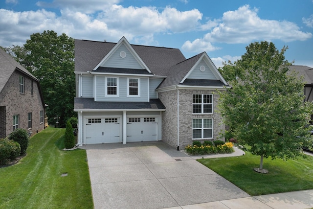 146 Monarchos Dr, Gallatin, TN 37066 - traditional-style house featuring driveway, a garage, a front lawn, and a shingled roof