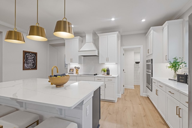 1069 Sycamore Ests, Nashville, TN 37211 - kitchen featuring custom exhaust hood, stainless steel double oven, white cabinets, black electric cooktop, and ornamental molding