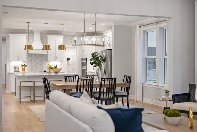 1069 Sycamore Ests, Nashville, TN 37211 - living area with light wood-style flooring, ornamental molding, baseboards, a chandelier, and recessed lighting