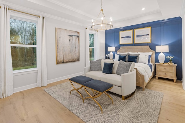 1069 Sycamore Ests, Nashville, TN 37211 - bedroom featuring a chandelier, wood finished floors, baseboards, a raised ceiling, and ornamental molding
