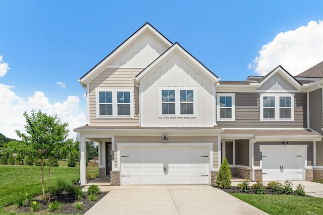 2208 Melk Ln, Columbia, TN 38401 - view of front of property with an attached garage, board and batten siding, concrete driveway, and a front yard