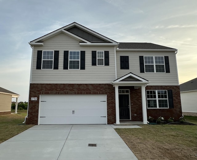 1734 Wren Way, Lebanon, TN 37087 - view of front of property featuring brick siding, a front yard, driveway, and an attached garage
