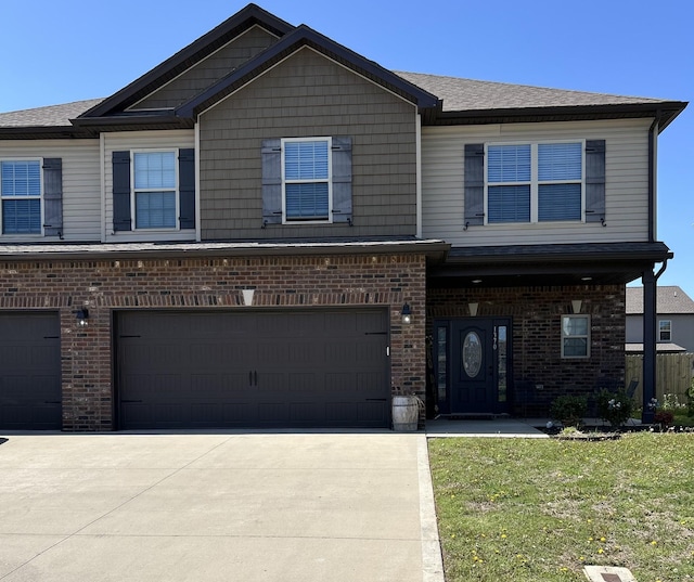 1370 Millet Dr, Clarksville, TN 37040 - view of front of property featuring a garage, brick siding, a front yard, and driveway