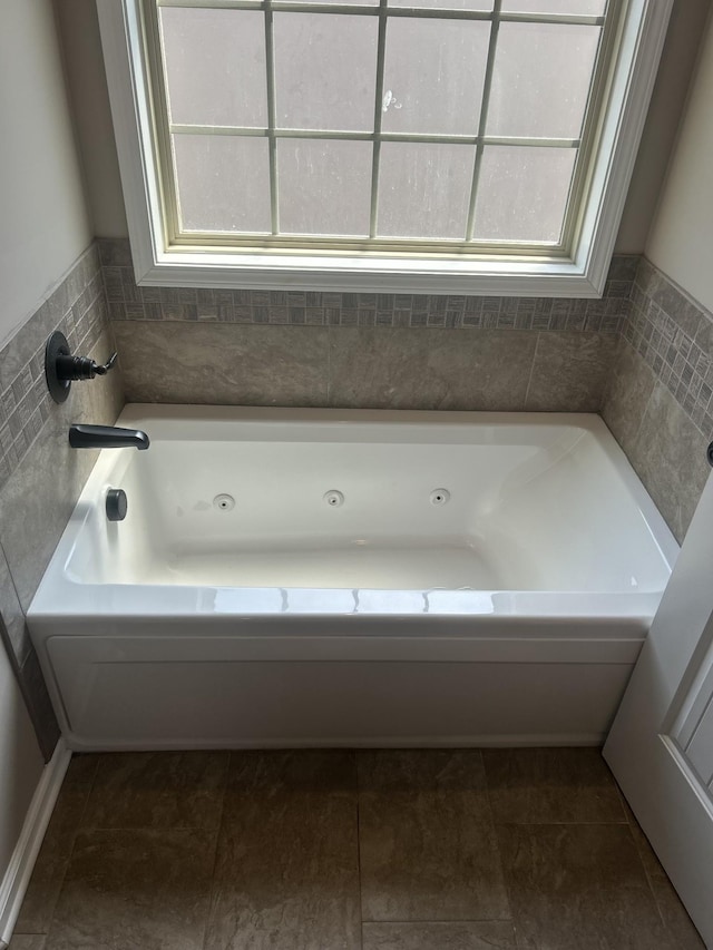 1370 Millet Dr, Clarksville, TN 37040 - full bath featuring healthy amount of natural light and a tub with jets