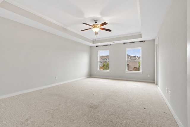 3368 Vinemont Dr, Thompsons Station, TN 37179 - carpeted spare room featuring a tray ceiling, ceiling fan, baseboards, and ornamental molding