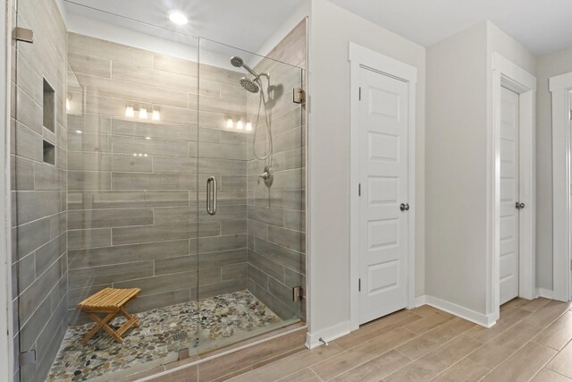 3368 Vinemont Dr, Thompsons Station, TN 37179 - full bathroom featuring a shower stall, wood finish floors, baseboards, and recessed lighting