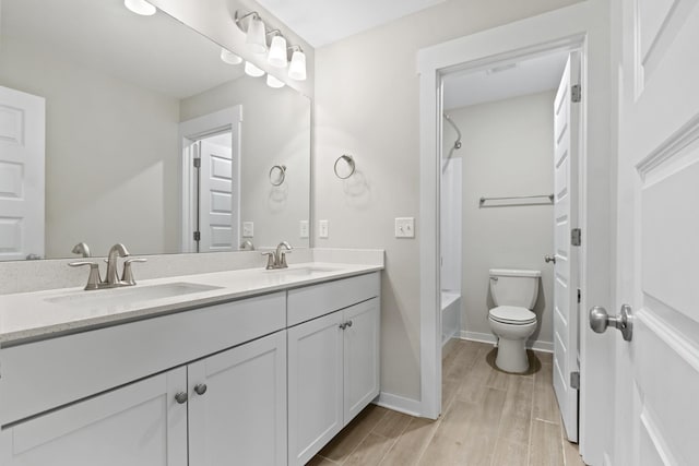 3368 Vinemont Dr, Thompsons Station, TN 37179 - full bathroom with double vanity,  shower combination, toilet, wood finished floors, and baseboards
