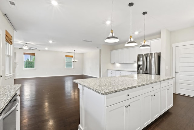 3368 Vinemont Dr, Thompsons Station, TN 37179 - kitchen featuring appliances with stainless steel finishes, dark wood-style floors, a ceiling fan, a center island, and white cabinets