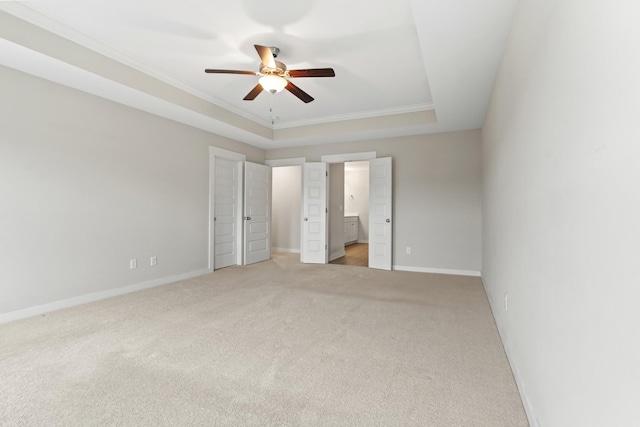 3368 Vinemont Dr, Thompsons Station, TN 37179 - unfurnished bedroom featuring light carpet, ornamental molding, a raised ceiling, baseboards, and ensuite bath