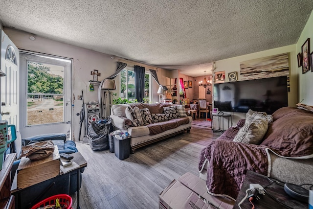 3846 Saunders Ave, Nashville, TN 37216 - living room with a chandelier, a textured ceiling, and wood finished floors