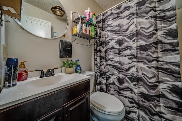 3846 Saunders Ave, Nashville, TN 37216 - bathroom featuring a textured ceiling, toilet, vanity, and curtained shower