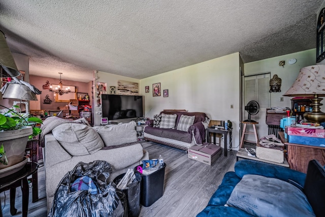 3846 Saunders Ave, Nashville, TN 37216 - living room with a chandelier, wood finished floors, and a textured ceiling