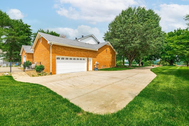 1234 Windsor Dr, Gallatin, TN 37066 - view of side of property with brick siding, driveway, an attached garage, and roof with shingles