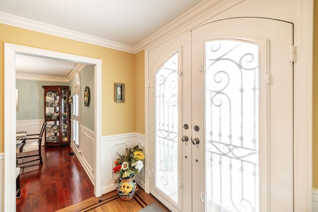 1234 Windsor Dr, Gallatin, TN 37066 - entrance foyer with french doors, dark wood finished floors, crown molding, a wainscoted wall, and a decorative wall