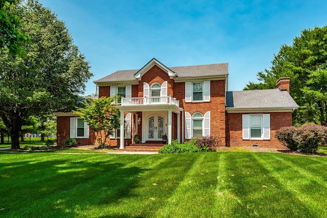 1234 Windsor Dr, Gallatin, TN 37066 - colonial house with brick siding, a balcony, and a front yard