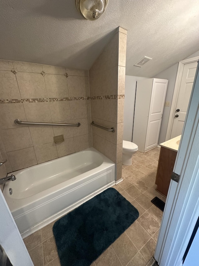 130 Post Oak Ave, Camden, TN 38320 - bathroom featuring toilet, vanity, bathtub / shower combination, tile patterned flooring, and a textured ceiling