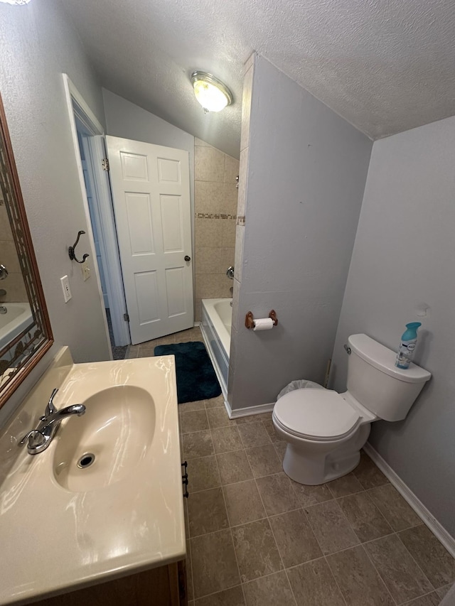 130 Post Oak Ave, Camden, TN 38320 - bathroom with toilet, vanity, a textured ceiling, tile patterned floors, and bathtub / shower combination