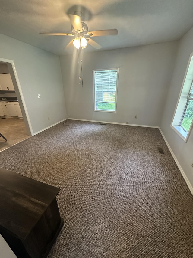 130 Post Oak Ave, Camden, TN 38320 - unfurnished room with ceiling fan, light colored carpet, and baseboards