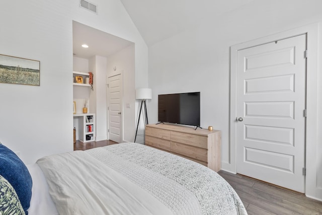 682 James Ave, Nashville, TN 37209 - bedroom with wood finished floors, vaulted ceiling, and recessed lighting