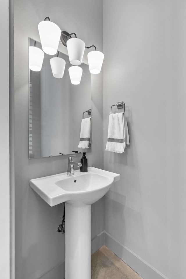 682 James Ave, Nashville, TN 37209 - bathroom with baseboards and a sink