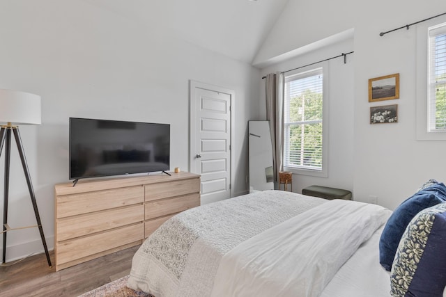 682 James Ave, Nashville, TN 37209 - bedroom featuring wood finished floors and vaulted ceiling
