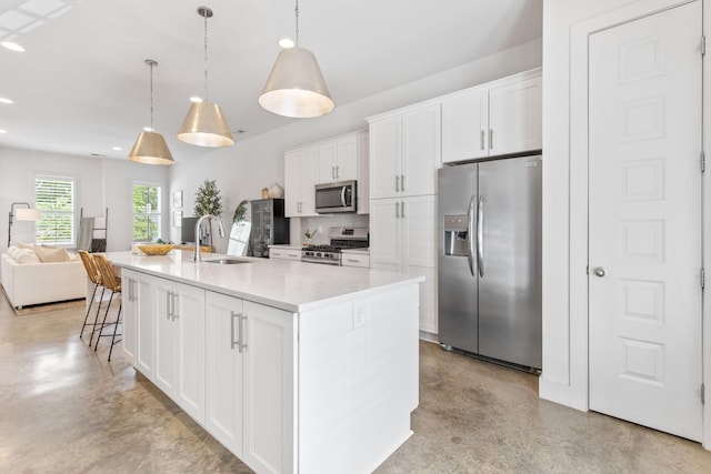 682 James Ave, Nashville, TN 37209 - kitchen with appliances with stainless steel finishes, finished concrete floors, a sink, open floor plan, and white cabinetry