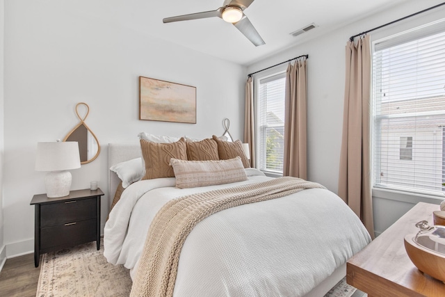 682 James Ave, Nashville, TN 37209 - bedroom with light wood finished floors, ceiling fan, and baseboards