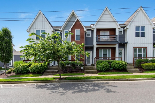 682 James Ave, Nashville, TN 37209 - view of front facade with a balcony, board and batten siding, and a porch