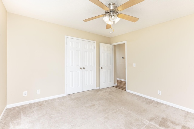 1036 Woodbrier Ln, Greenbrier, TN 37073 - unfurnished bedroom with light carpet, baseboards, a closet, and a ceiling fan