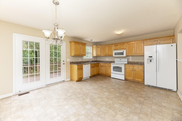 1036 Woodbrier Ln, Greenbrier, TN 37073 - kitchen with white appliances, a chandelier, baseboards, and dark countertops