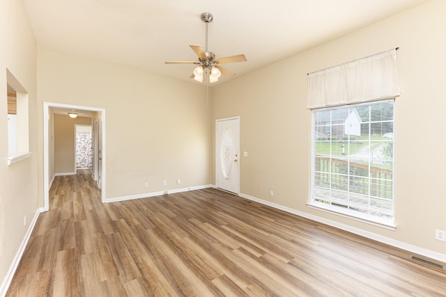 1036 Woodbrier Ln, Greenbrier, TN 37073 - empty room featuring light wood-style flooring, a ceiling fan, baseboards, and lofted ceiling