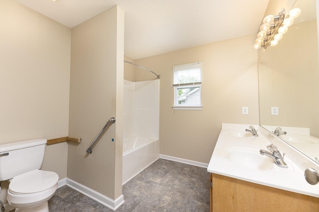 1036 Woodbrier Ln, Greenbrier, TN 37073 - bathroom featuring baseboards, toilet, double vanity, and stone finish flooring