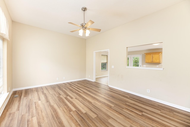1036 Woodbrier Ln, Greenbrier, TN 37073 - unfurnished room featuring light wood-type flooring, a ceiling fan, and baseboards
