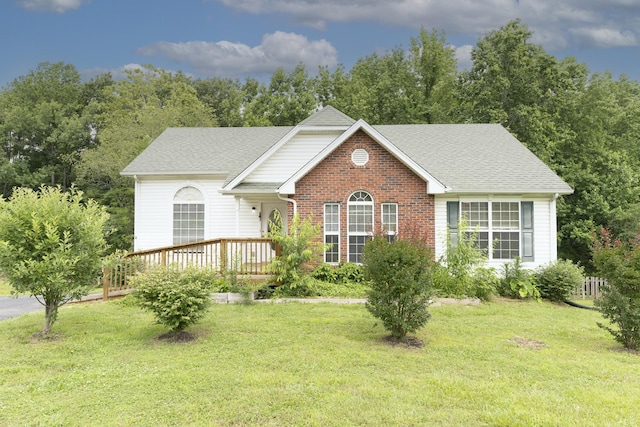 1036 Woodbrier Ln, Greenbrier, TN 37073 - view of front facade featuring a front lawn, a shingled roof, and brick siding