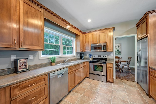 80 Latimer Cemetery Ln, Waverly, TN 37185 - kitchen with stainless steel appliances, a sink, light tile patterned floors, recessed lighting, and brown cabinetry