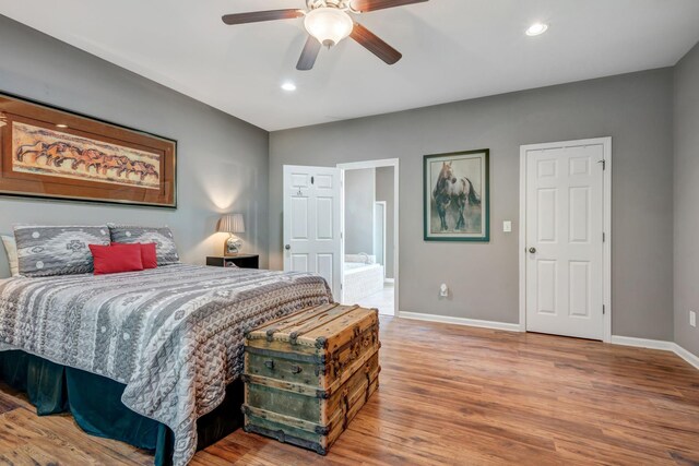 80 Latimer Cemetery Ln, Waverly, TN 37185 - bedroom with baseboards, wood finished floors, recessed lighting, ceiling fan, and ensuite bathroom