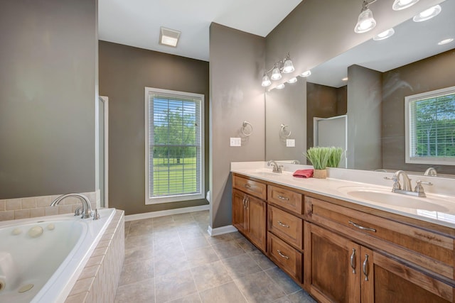 80 Latimer Cemetery Ln, Waverly, TN 37185 - bathroom with double vanity, a bath, a stall shower, tile patterned flooring, and baseboards